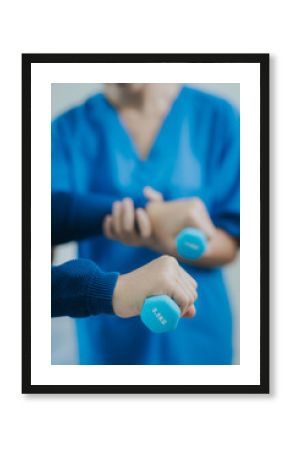 Asian female doctor or nurse exercising with elderly man at hospital