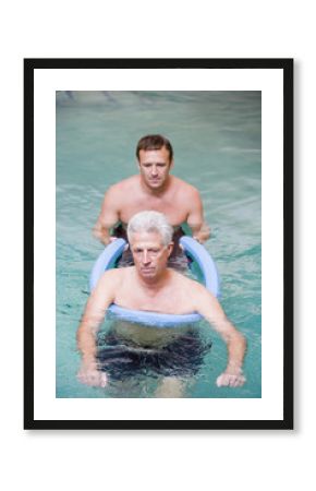 Instructor And Patient Undergoing Water Therapy