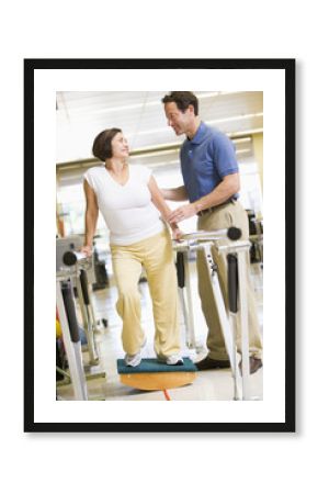 Physiotherapist With Patient In Rehabilitation