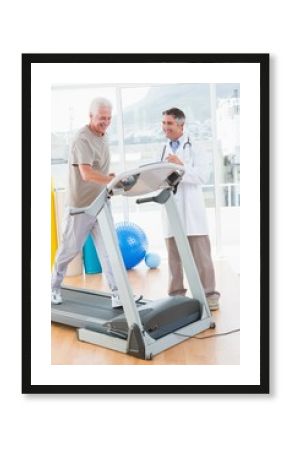 Senior man on treadmill with therapist