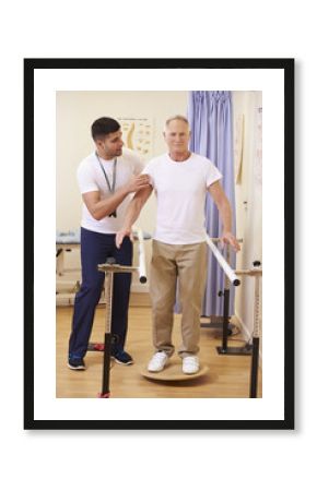 Senior Male Patient Having Physiotherapy In Hospital