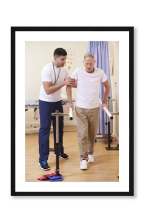 Senior Male Patient Having Physiotherapy In Hospital