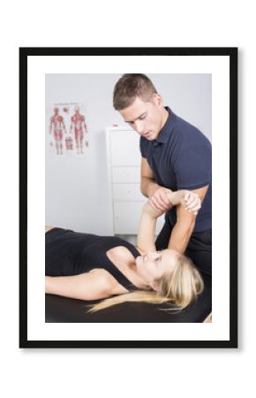 male physio therapist and woman helping patient