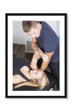 male physio therapist and woman helping patient