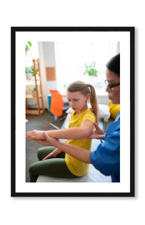 Calm skinny long-haired child pulling hands and presenting abilities