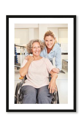 Physiotherapist with senior woman in wheelchair