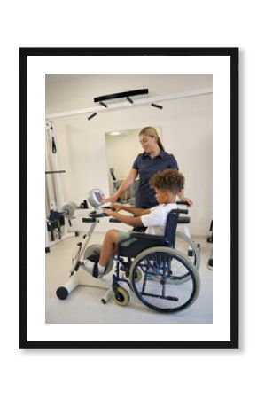 Female physiotherapist assists patient in their exercise routine