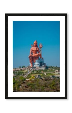 Vertical shot of the historic red Shiva Statue in Nathdwara, India