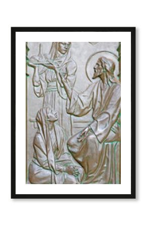 BERLIN, GERMANY, FEBRUARY - 14, 2017: The bronze relief of Dialog of Jesus Visit Martha and Mary on the gate of Dom by Otto Lessing (1906).