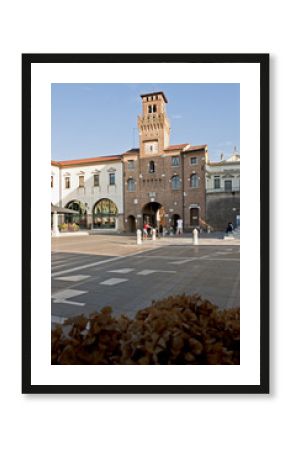 The clock tower or "Torresin" in Piazza Grande in Oderzo. Ancient city of Roman origin in the province of Treviso, Italy.