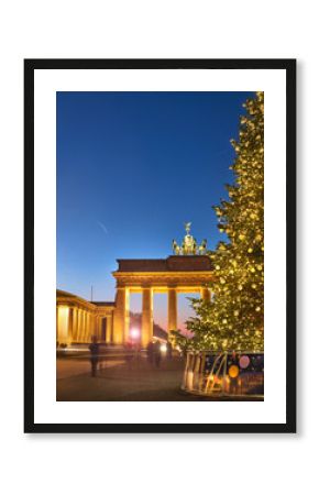 Brandenburger Gate in Berlin with Christmas tree at night