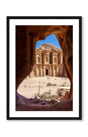 Stunning view from a cave of the Ad Deir - Monastery in the ancient city of Petra, Jordan, Incredible UNESCO World Heritage Site.