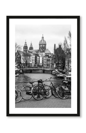 Bicycles on a bridge in Amsterdam, Netherlands. Black and white image.