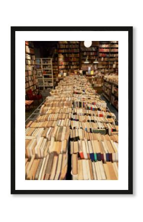 Variety of books arranged in row at library
