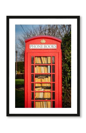 An old phone box repurposed as a library