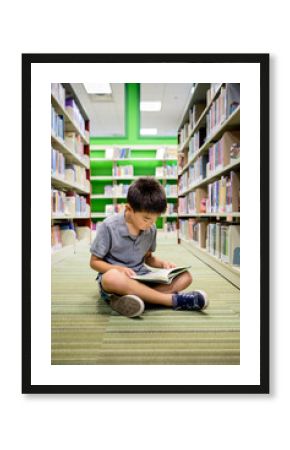 Asian kid studying in a public library