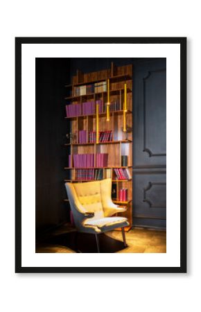 Saint Petersburg, Russia - 07.06.2020: empty white armchair in vintage library with red books