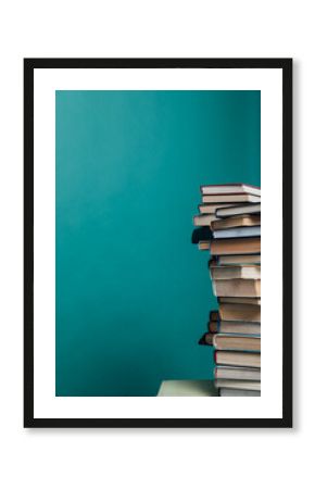 stacks of books for teaching knowledge of the university library green background