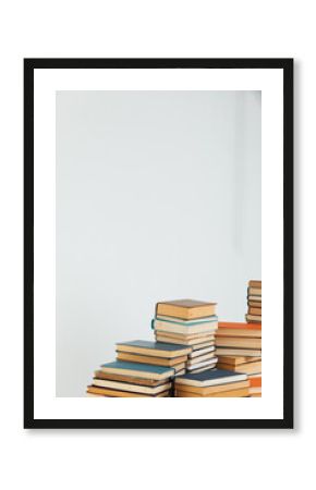 Stacks of old books in study library on white background