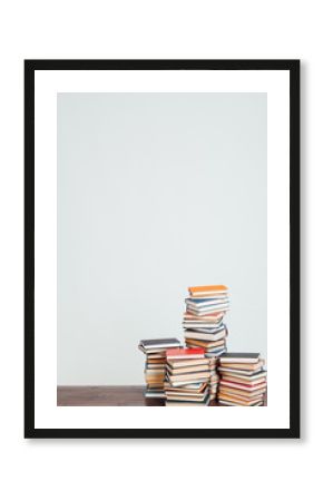 a lot of educational books for exams at the university on the white background of the library