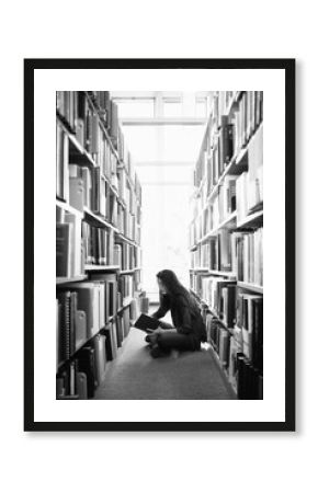 Young asian woman reading in library