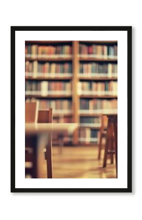 Warm and inviting library interior with wooden bookshelves filled with vintage books and soft focus on wooden study tables in the foreground