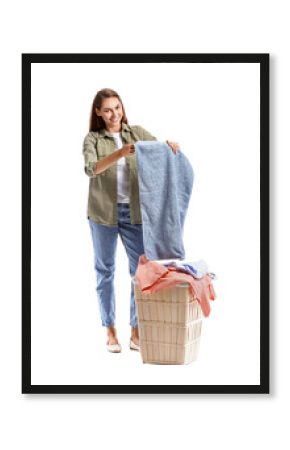 Beautiful housewife with laundry and big basket on white background