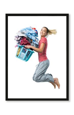 Happy woman doing laundry and jumping