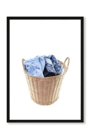 Clothes in a laundry wooden basket isolated on white background. Clipping path.