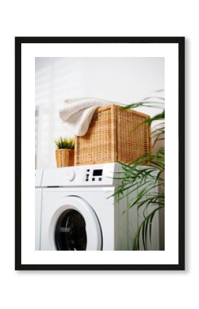 White Towels In Wicker Basket On Top Of White Washing Machine