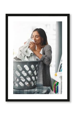 Woman, smell laundry and basket for towel in home, hygiene and fresh linen or clean aroma. Female person, breathe and housework tasks on morning, check fabric and textures or maid for fragrance scent