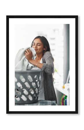 Woman, smell laundry and basket for clean towel in home, hygiene and fresh linen aroma. Female person, breathe and housework tasks on morning, check fabric and cleaner or maid for fragrance scent