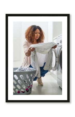 Woman, home and unsure with washing machine for laundry in household keeping, basket and hygiene. Female person, fabric and worried on chores or detergent routine and cleaning clothes with appliances