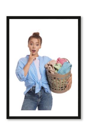 Emotional housewife with basket full of laundry on white background