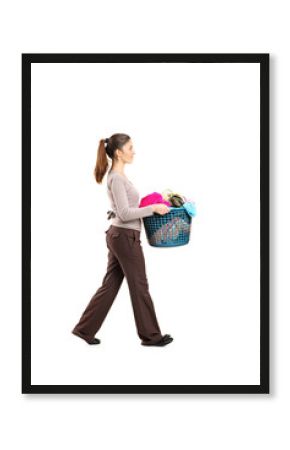 Full length portrait of a female holding a laundry basket