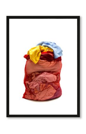 Laundry stuffed in red laundry bag.
