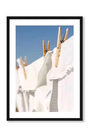 White clothes hung out to dry in the bright warm sun