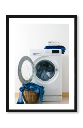 Close up washing machine and clothes in basket on white background. Laundry concept.