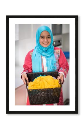 Muslim girl with laundry