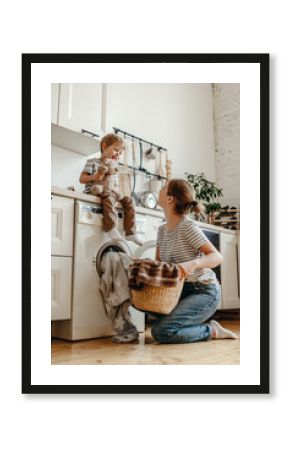 Happy family mother housewife and child   in laundry with washing machine .