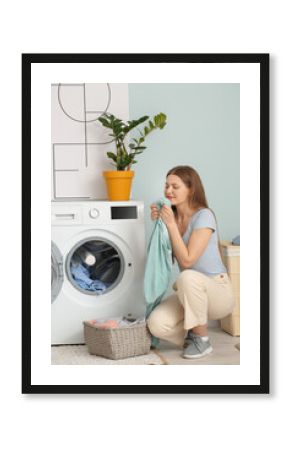 Young woman doing laundry at home