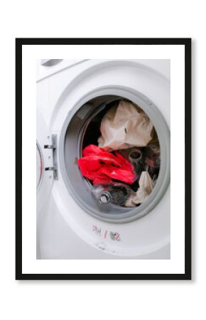 Washing machine filled with plastic waste representing micro plastic waste pollution during laundry