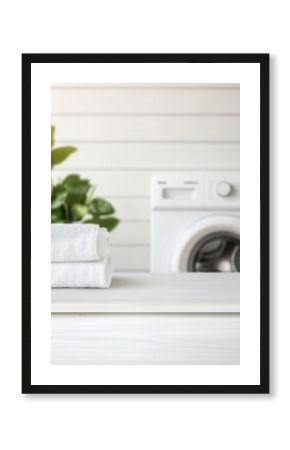 Fresh towels on a white surface, near a washing machine.