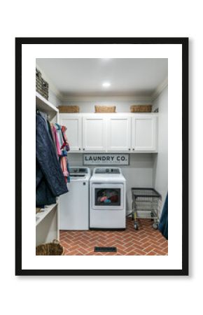 Laundry room with washer and dryer inside a master bedroom walk in closet