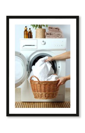 Concept of housework with washing machine against white wall