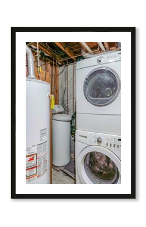 Vertical Basement interior with laundry appliances and water tank