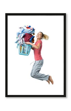 Happy woman doing laundry and jumping