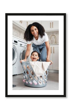 Happy mother with her child in a washing basket at their home while doing laundry together. Happiness. housework and portrait of a young woman having fun with her girl kid while cleaning the house.