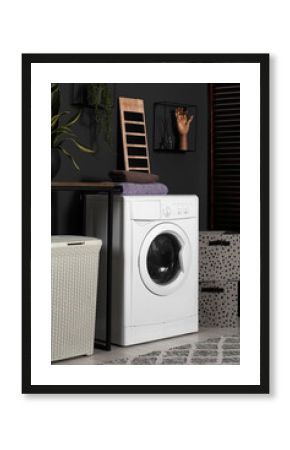 Stylish laundry room with washing machine. Interior design