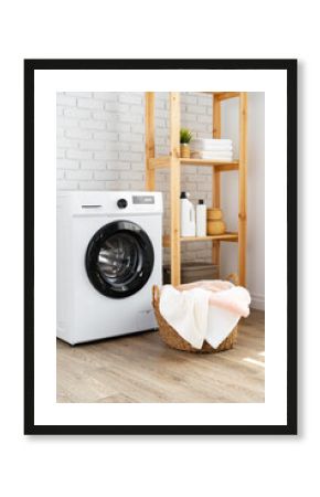 Laundry room with washing machine and basket with laundry